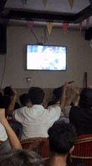 Football watch party in a festively decorated indoor venue