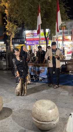 Traditional street performance lights up Malioboro Street at night