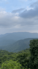 Tourists view scenic mountain landscapes in Chorla, India