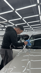 Vehicle detailing and wrapping work underway at Krasnoyarsk auto shop
