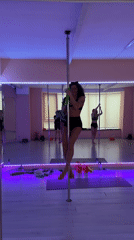 Woman practices pole dancing in Tbilisi studio