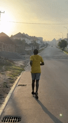 Morning jogger documented across Guzape Nigeria residential streets