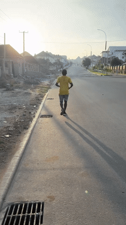Morning jogger documented across Guzape Nigeria residential streets