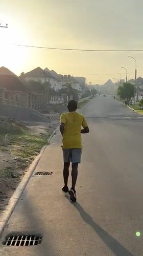 Morning jogger documented across Guzape Nigeria residential streets