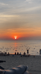 Nha Trang beach fills up at golden hour sunset