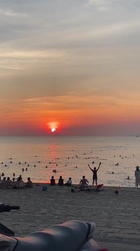 Nha Trang beach fills up at golden hour sunset