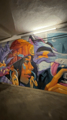 Person documents street art in Sofia underpass