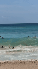 Beach activity documented at Kuta Selatan on sunny morning