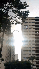 Kids play on Caracas courts as neighborhood life carries on