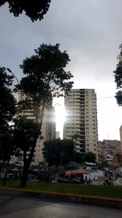 Kids play on Caracas courts as neighborhood life carries on