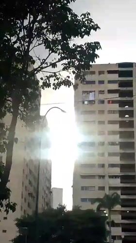 Kids play on Caracas courts as neighborhood life carries on