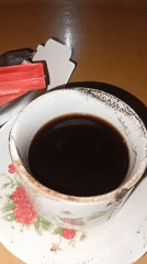 Coffee cups and garden details in a quiet Indonesian morning