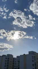 Camera captures sunny afternoon sky over Saratov apartment buildings