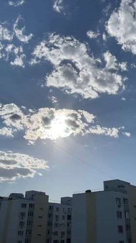 Camera captures sunny afternoon sky over Saratov apartment buildings