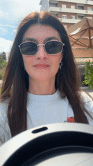 Woman enjoys coffee outdoors in sunny Podgorica
