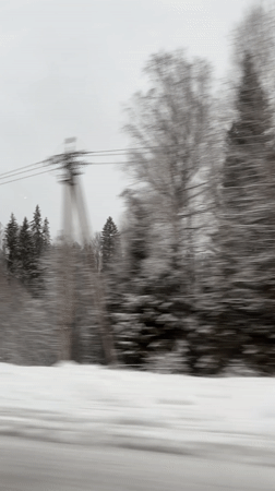 Snow-covered landscape captured from moving vehicle in Garevaya, Russia
