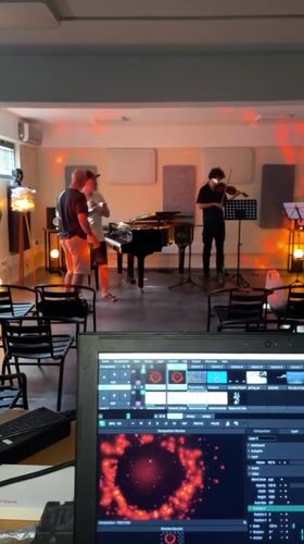 Musical trio rehearses in Tivat venue with recording setup