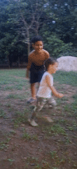 Family enjoys evening playtime in Venezuelan yard