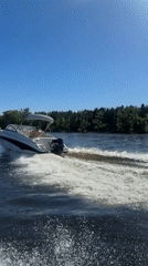White motorboat spotted cruising under clear skies