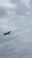 Ryanair aircraft departs over water near Martil, Morocco