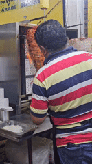 Late-night taco vendor prepares al pastor in Mexico
