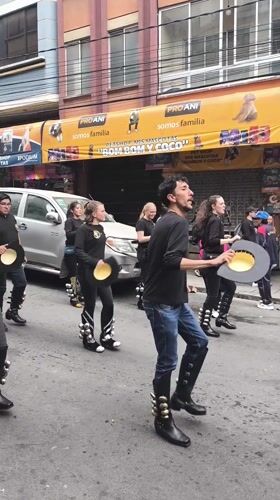 Street dancers perform coordinated procession in La Paz Bolivia