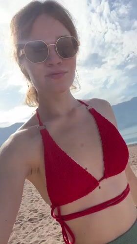 Woman enjoys early morning beach time in Boreti, Montenegro
