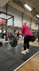 Woman performs late-night deadlift workout at Chaikovsky gym
