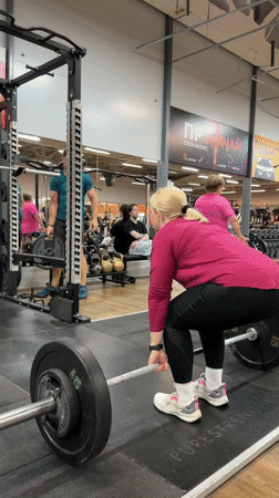Woman performs late-night deadlift workout at Chaikovsky gym