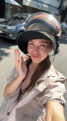 Woman records selfie video while riding motorbike in Nha Trang