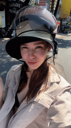 Woman records selfie video while riding motorbike in Nha Trang