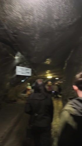 Tourists explore historic Wieliczka Salt Mine underground chambers and exhibits