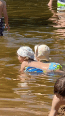 Children play at Moscow waterfront on sunny morning