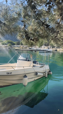 Peaceful morning harbor scene documented in Škaljari, Montenegro
