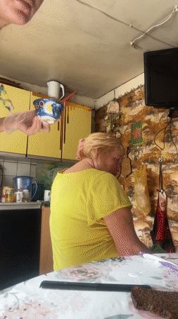 Woman photographed at playground beneath colorful equipment