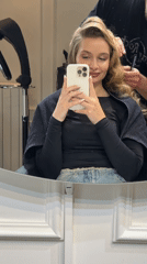 Woman styles hair at Belgrade salon, documents process