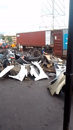 Auto salvage workers repair engines in Onitsha yard