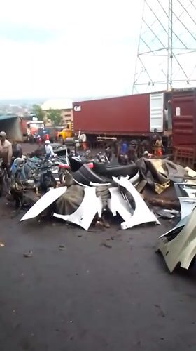 Auto salvage workers repair engines in Onitsha yard