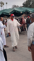 Street performer draws crowd in Marrakesh public square