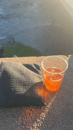 Afternoon beverage moment captured in Turin's golden hour