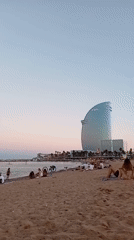 Barcelona beach at golden hour, late summer evening