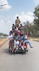 Overcrowded pickup truck carries 20 passengers through Bukuru, Nigeria