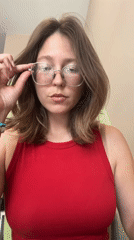 Woman in red tank top spotted around Podgorica taking selfie