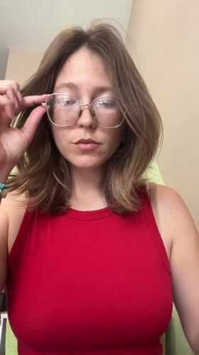 Woman in red tank top spotted around Podgorica taking selfie