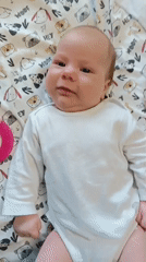 Baby playtime captured on patterned mats in Andreyevo