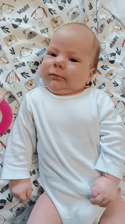 Baby playtime captured on patterned mats in Andreyevo