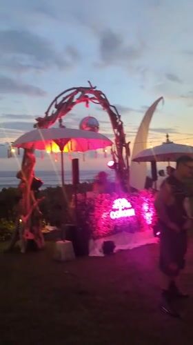 Evening oceanside party with DJ, pool gathering in Kediri