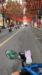 Flag-decorated street scenes captured by motorcycle riders in Vietnam