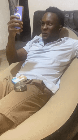 Man relaxes at home in Kubwa, Nigeria