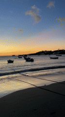 Twilight coastal scene with fishing boats in Juan Griego